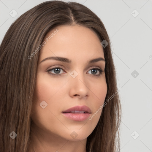 Neutral white young-adult female with long  brown hair and brown eyes