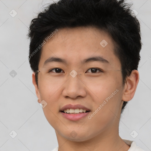 Joyful asian young-adult male with short  brown hair and brown eyes