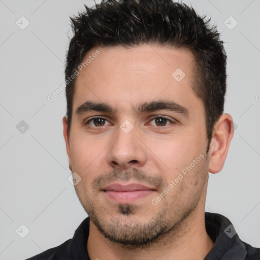 Joyful white young-adult male with short  black hair and brown eyes