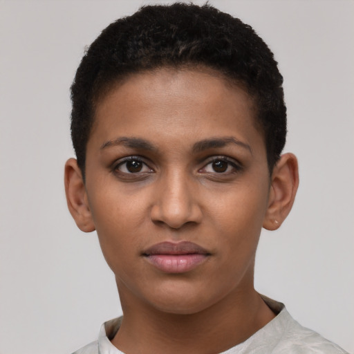 Joyful black young-adult female with short  brown hair and brown eyes