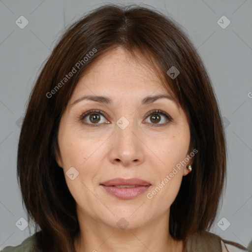 Joyful white adult female with medium  brown hair and brown eyes