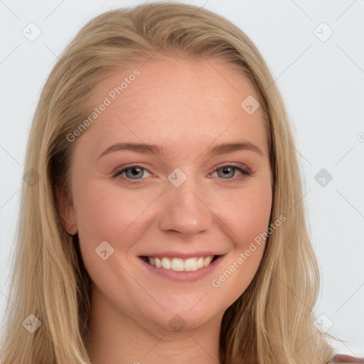 Joyful white young-adult female with long  brown hair and blue eyes