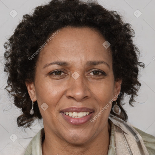 Joyful black adult female with short  brown hair and brown eyes