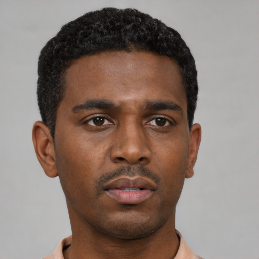 Neutral black young-adult male with short  black hair and brown eyes