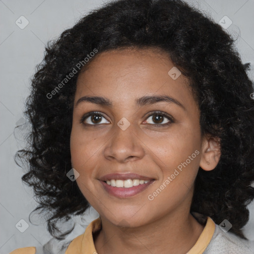 Joyful black young-adult female with medium  brown hair and brown eyes