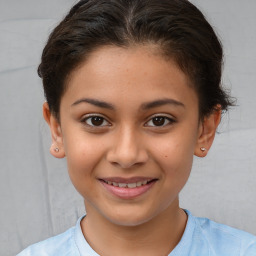 Joyful white child female with short  brown hair and brown eyes