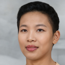 Joyful asian young-adult female with short  black hair and brown eyes