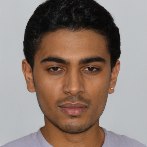 Neutral latino young-adult male with short  black hair and brown eyes
