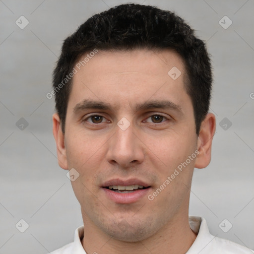 Joyful white young-adult male with short  brown hair and brown eyes