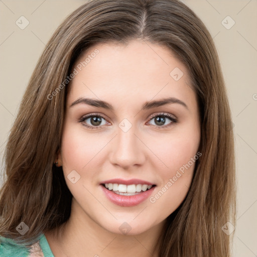 Joyful white young-adult female with long  brown hair and green eyes