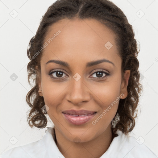 Joyful black young-adult female with long  brown hair and brown eyes