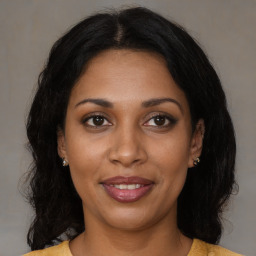 Joyful black young-adult female with medium  brown hair and brown eyes