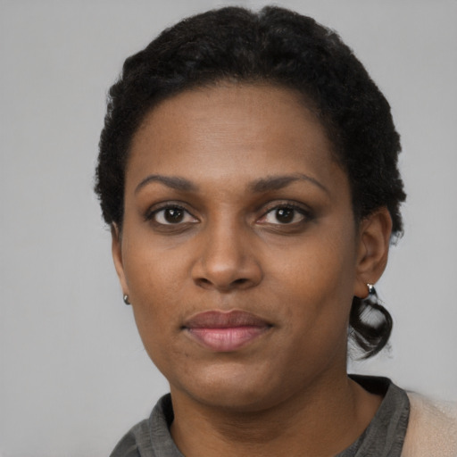 Neutral black adult female with short  black hair and brown eyes