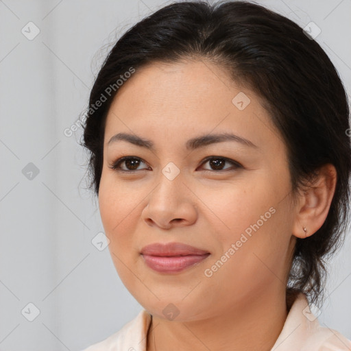 Joyful latino young-adult female with medium  brown hair and brown eyes