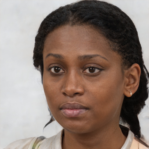 Neutral black young-adult female with medium  black hair and brown eyes