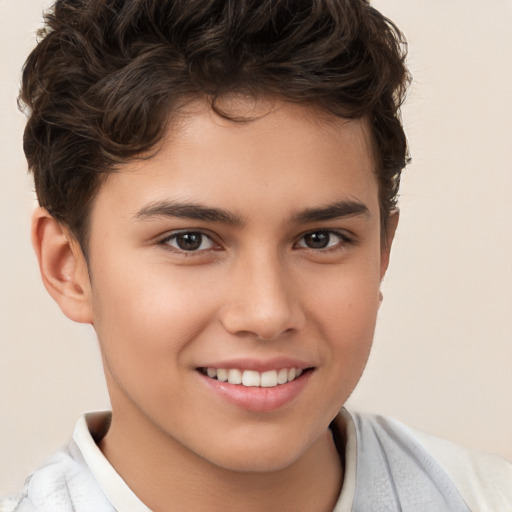 Joyful white child male with short  brown hair and brown eyes