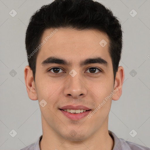 Joyful latino young-adult male with short  brown hair and brown eyes