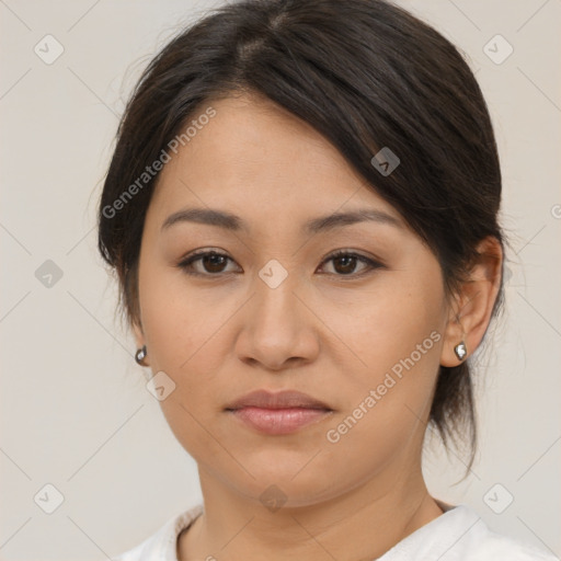 Joyful asian young-adult female with medium  brown hair and brown eyes