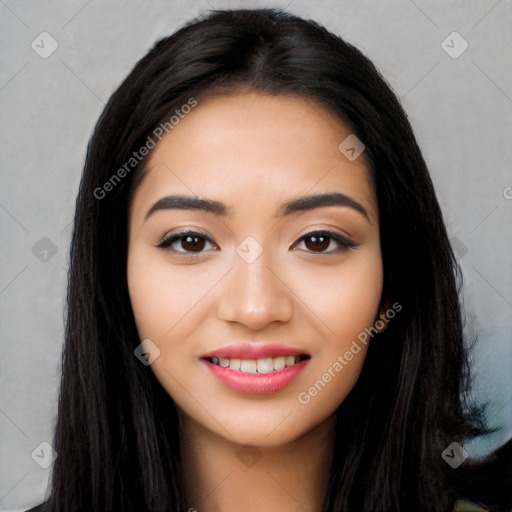 Joyful latino young-adult female with long  black hair and brown eyes