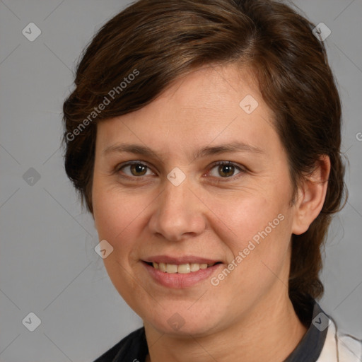 Joyful white adult female with medium  brown hair and brown eyes