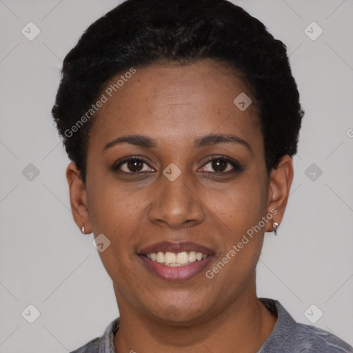 Joyful black young-adult female with short  black hair and brown eyes