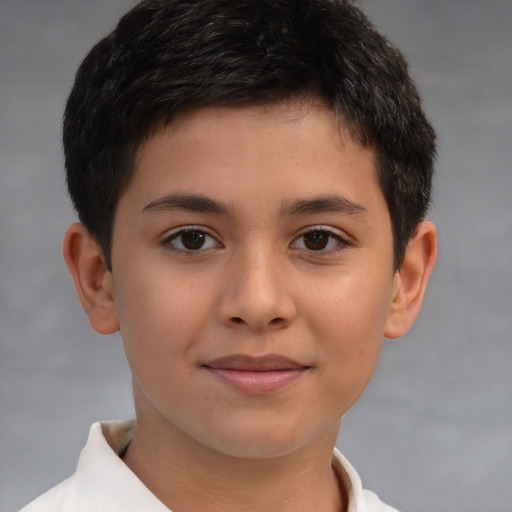 Joyful white child male with short  brown hair and brown eyes