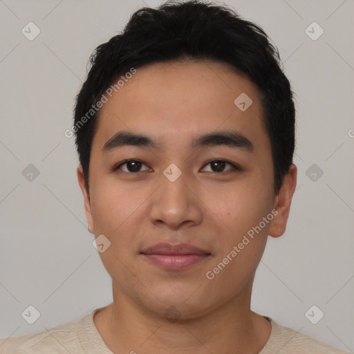 Joyful asian young-adult male with short  black hair and brown eyes