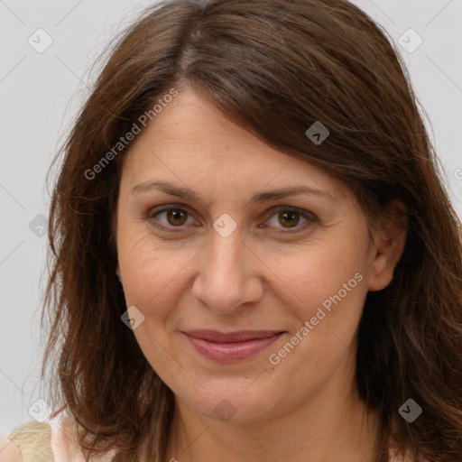 Joyful white adult female with medium  brown hair and brown eyes