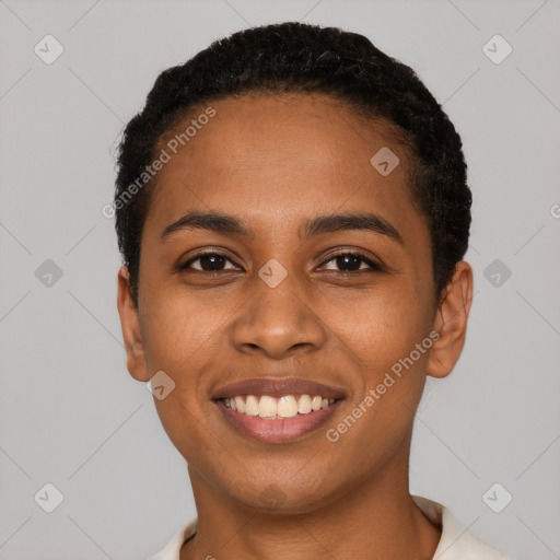 Joyful black young-adult female with short  black hair and brown eyes