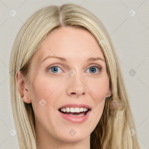 Joyful white young-adult female with long  brown hair and blue eyes