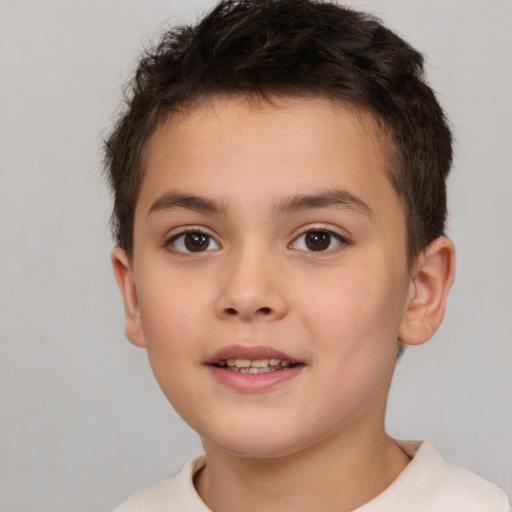 Joyful white child male with short  brown hair and brown eyes