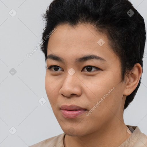 Joyful asian young-adult female with short  black hair and brown eyes