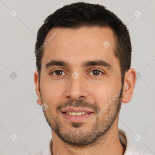 Joyful white young-adult male with short  black hair and brown eyes