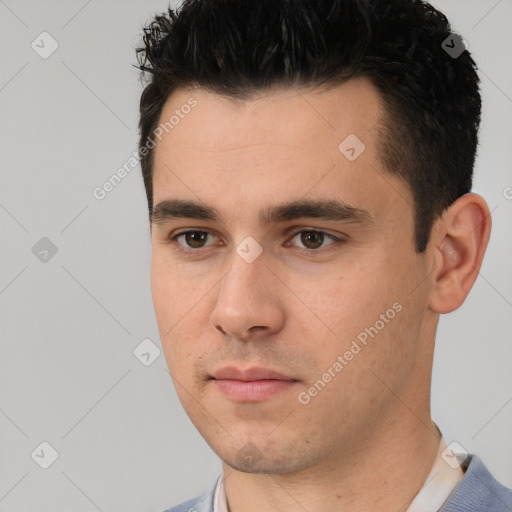 Neutral white young-adult male with short  black hair and brown eyes