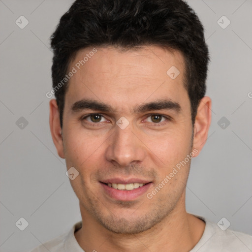 Joyful white young-adult male with short  black hair and brown eyes