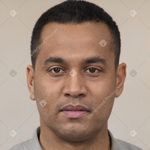 Neutral latino young-adult male with short  black hair and brown eyes