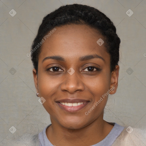 Joyful black young-adult female with short  black hair and brown eyes