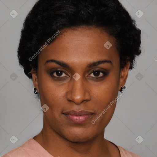 Joyful black young-adult female with short  black hair and brown eyes