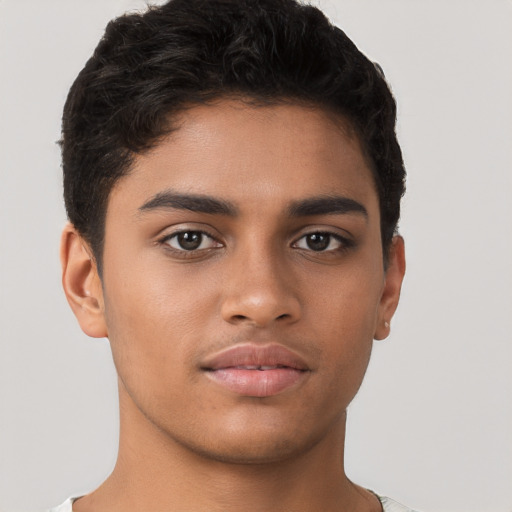 Neutral latino young-adult male with short  brown hair and brown eyes