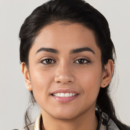 Joyful white young-adult female with long  brown hair and brown eyes