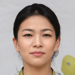 Neutral asian young-adult female with medium  brown hair and brown eyes