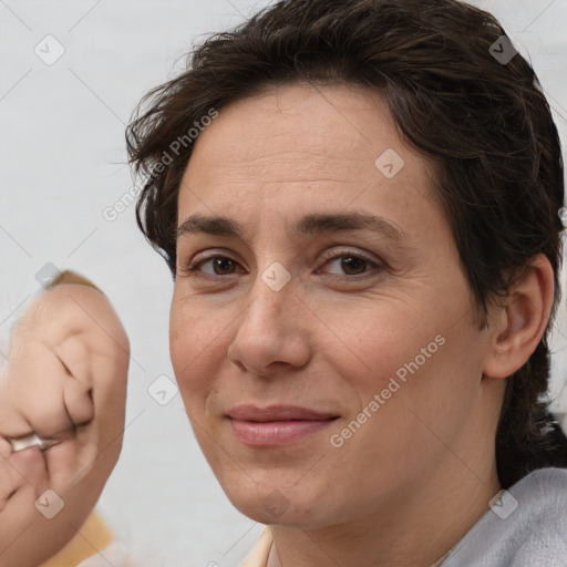 Joyful white adult female with short  brown hair and brown eyes