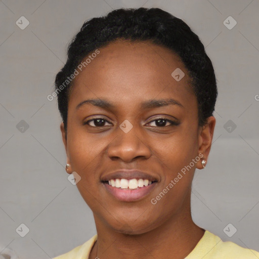 Joyful black young-adult female with short  black hair and brown eyes