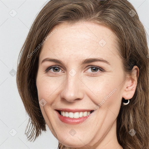 Joyful white young-adult female with long  brown hair and grey eyes