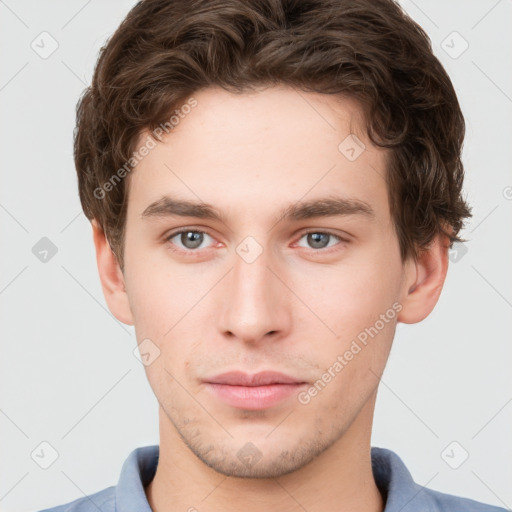 Neutral white young-adult male with short  brown hair and grey eyes