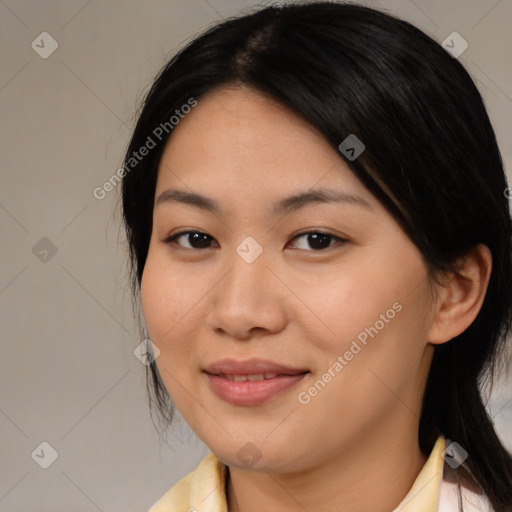 Joyful asian young-adult female with medium  black hair and brown eyes