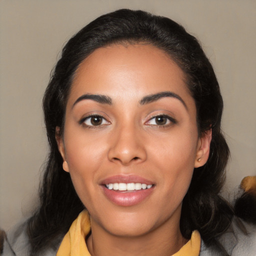 Joyful latino young-adult female with medium  black hair and brown eyes