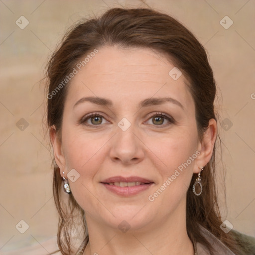 Joyful white adult female with medium  brown hair and grey eyes