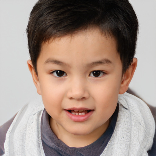 Joyful white child male with short  brown hair and brown eyes