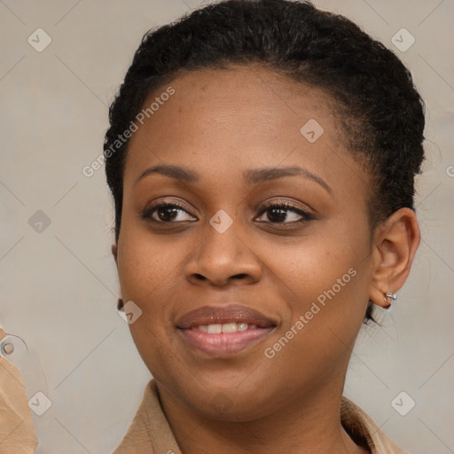 Joyful black young-adult female with short  brown hair and brown eyes